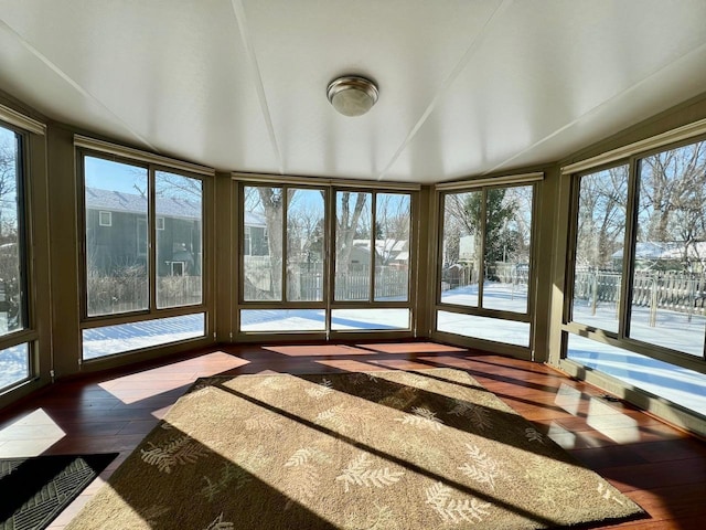 unfurnished sunroom with a wealth of natural light