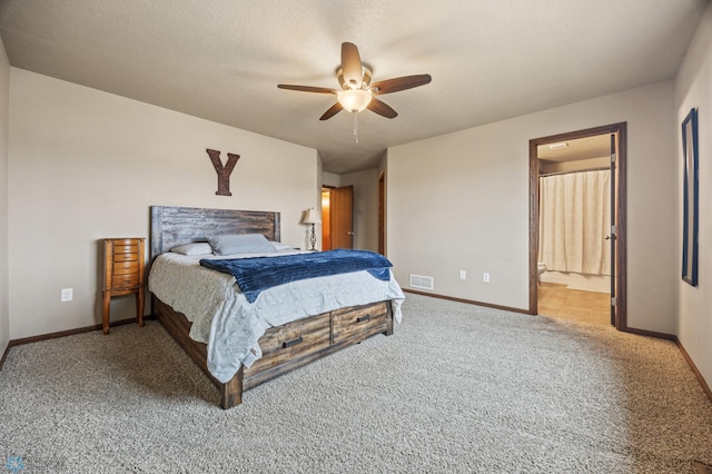 bedroom featuring ceiling fan, connected bathroom, light carpet, visible vents, and baseboards