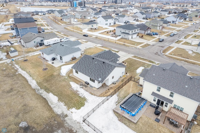 birds eye view of property with a residential view