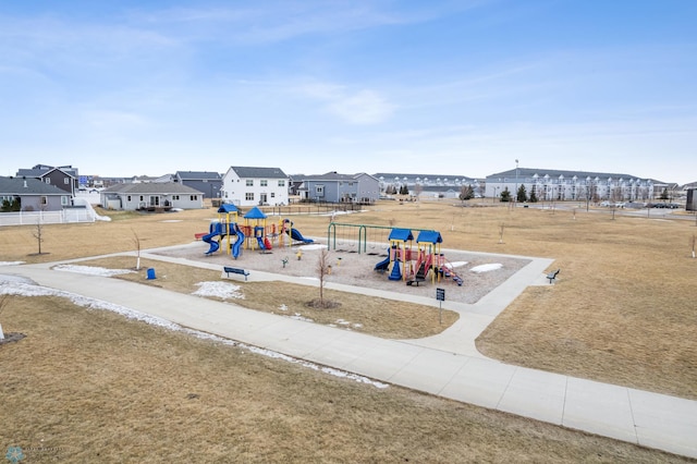 communal playground featuring a residential view