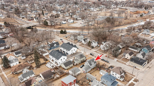 birds eye view of property with a residential view