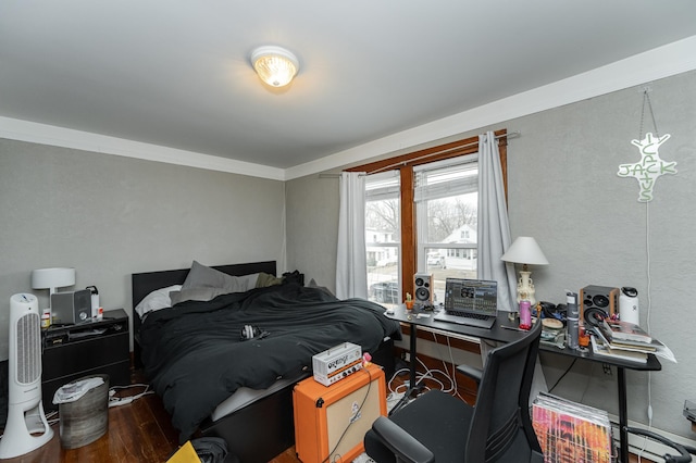 bedroom with wood finished floors