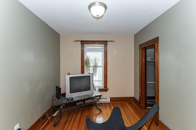 office area with wood finished floors and baseboards