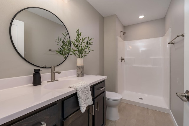 full bath with recessed lighting, vanity, toilet, and walk in shower