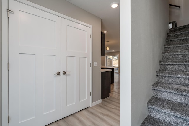 3112 Scotch Ln, Mankato, MN 56001 - stairway featuring wood finished floors, recessed lighting, and baseboards