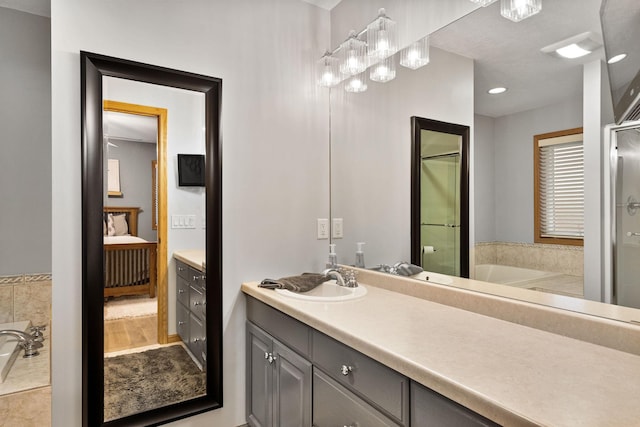 full bath featuring connected bathroom, an enclosed shower, vanity, and a bath