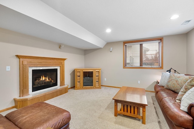 living area featuring recessed lighting, visible vents, light carpet, and baseboards