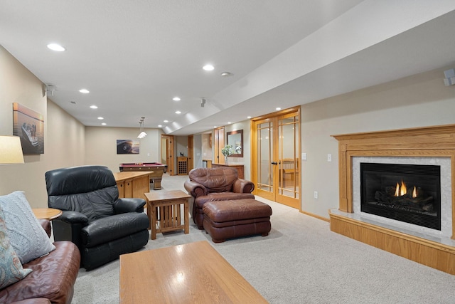 living area featuring recessed lighting, light colored carpet, billiards, and a glass covered fireplace