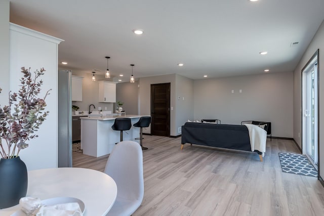 3108 Scotch Ln, Mankato, MN 56001 - living area featuring light wood-type flooring, recessed lighting, and baseboards