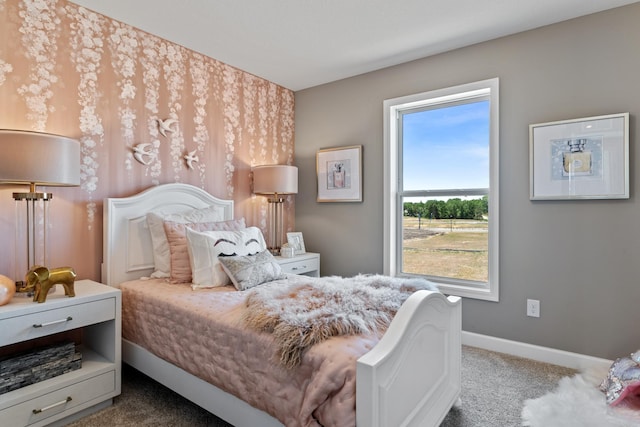 carpeted bedroom with baseboards