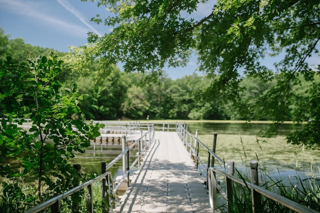 surrounding community featuring a water view