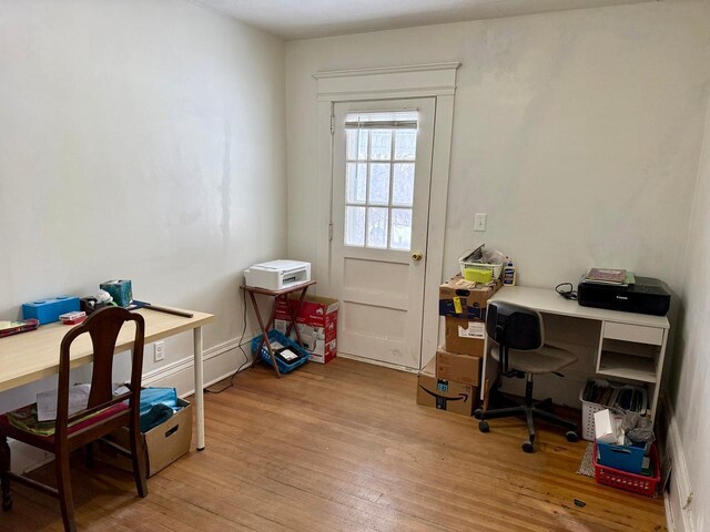office space with light wood finished floors