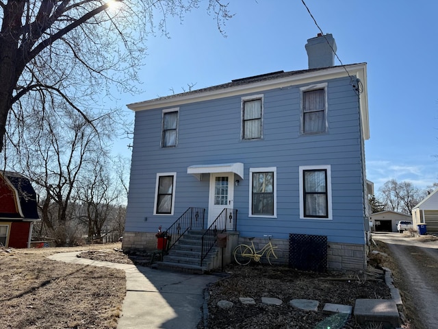 view of front of property featuring a chimney