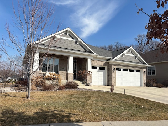 craftsman house with a garage, covered porch, brick siding, concrete driveway, and a front yard