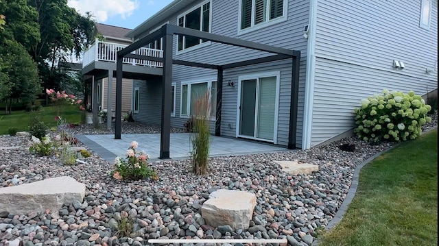 back of property with a patio area and a wooden deck