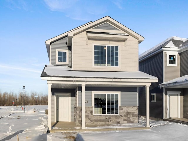 view of front facade featuring a porch and stone siding