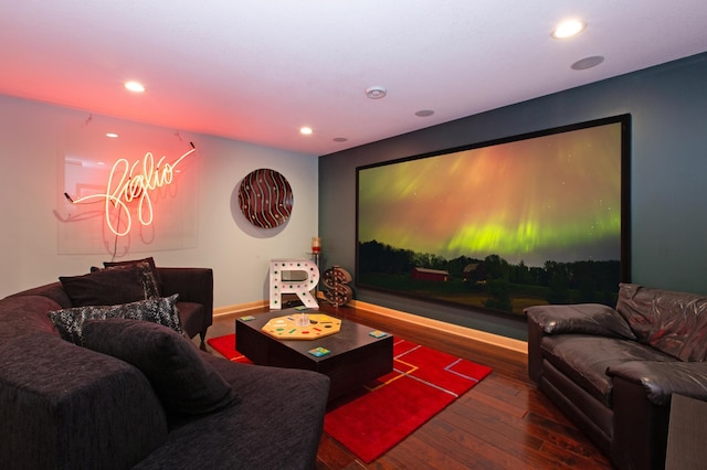 cinema room with hardwood / wood-style floors and recessed lighting