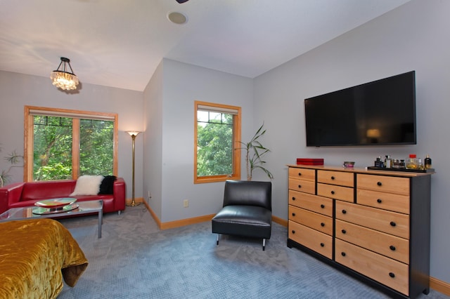 bedroom with carpet floors, multiple windows, baseboards, and a notable chandelier