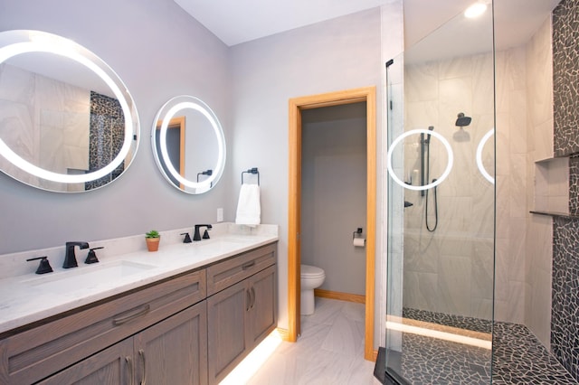 full bathroom with double vanity, a sink, toilet, and a walk in shower