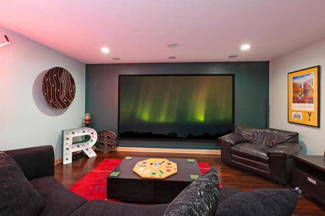 living area featuring wood finished floors and recessed lighting