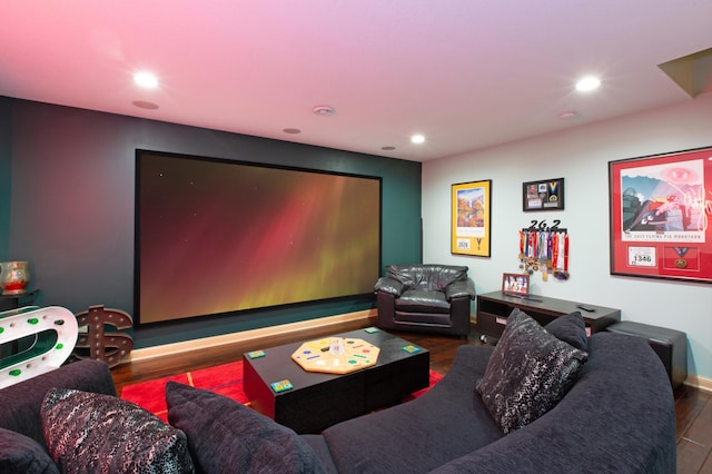 home theater room featuring wood finished floors and recessed lighting