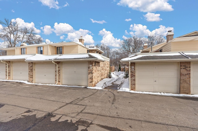 view of snow covered garage