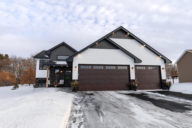 modern farmhouse with a garage and board and batten siding