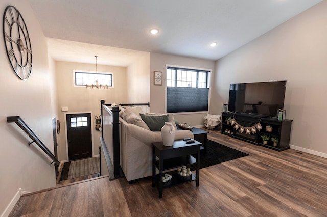 living area with a chandelier, recessed lighting, baseboards, and dark wood-style flooring