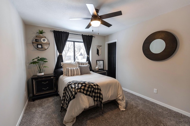 bedroom featuring a ceiling fan, baseboards, and dark colored carpet