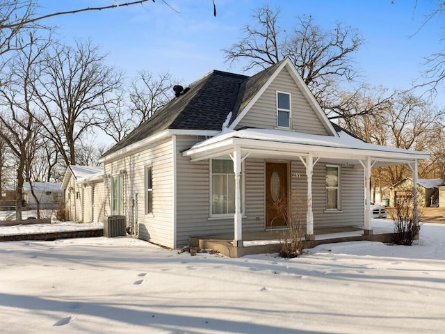 view of front of house with a porch and roof with shingles