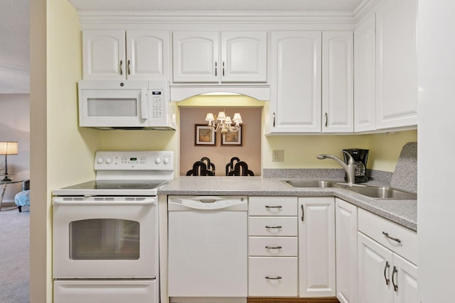 kitchen featuring a sink, white appliances, white cabinets, and light countertops