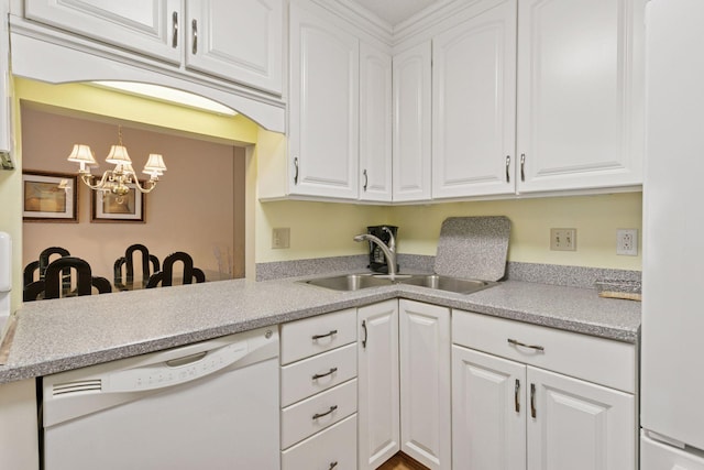 kitchen featuring white cabinetry, light countertops, white dishwasher, and a sink