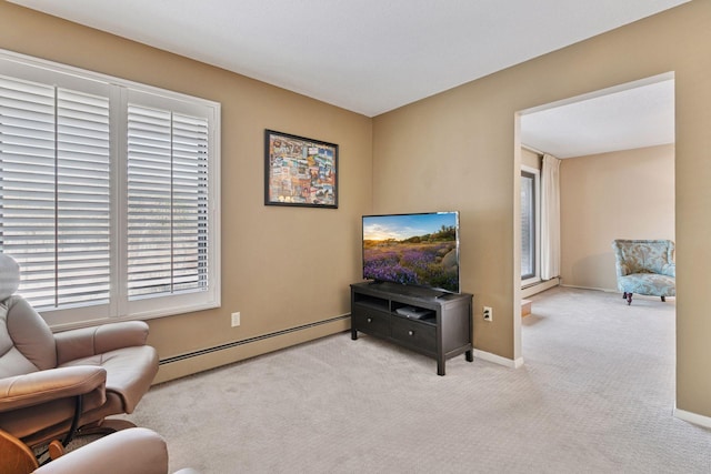 carpeted living area featuring baseboards and baseboard heating