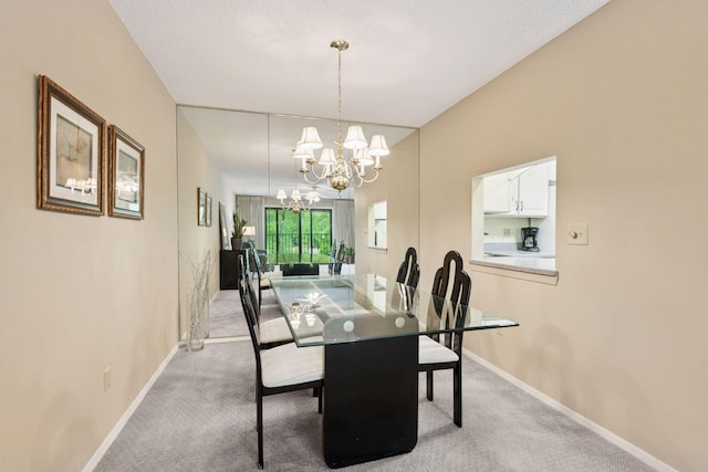 7520 Cahill Rd Unit 121A, Edina, MN 55439 - dining area with a chandelier, baseboards, and carpet flooring