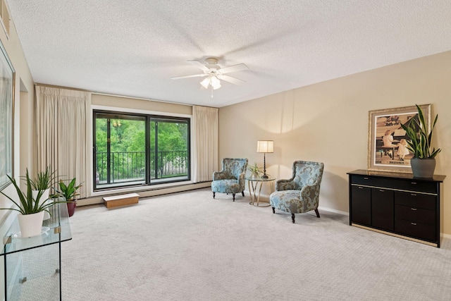 7520 Cahill Rd Unit 121A, Edina, MN 55439 - living area featuring carpet floors, a ceiling fan, a textured ceiling, and baseboards