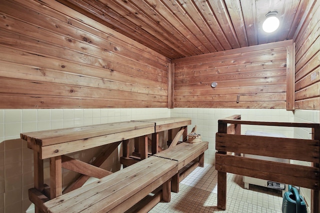 7520 Cahill Rd Unit 121A, Edina, MN 55439 - relaxing sauna / steam room with wooden walls, wood ceiling, tile patterned flooring, and a wainscoted wall