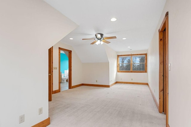 additional living space featuring baseboards, light colored carpet, lofted ceiling, recessed lighting, and a ceiling fan