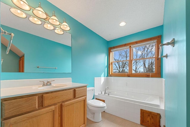 full bath featuring tile patterned floors, toilet, a textured ceiling, a bath, and vanity