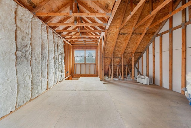 attic featuring a wall mounted AC