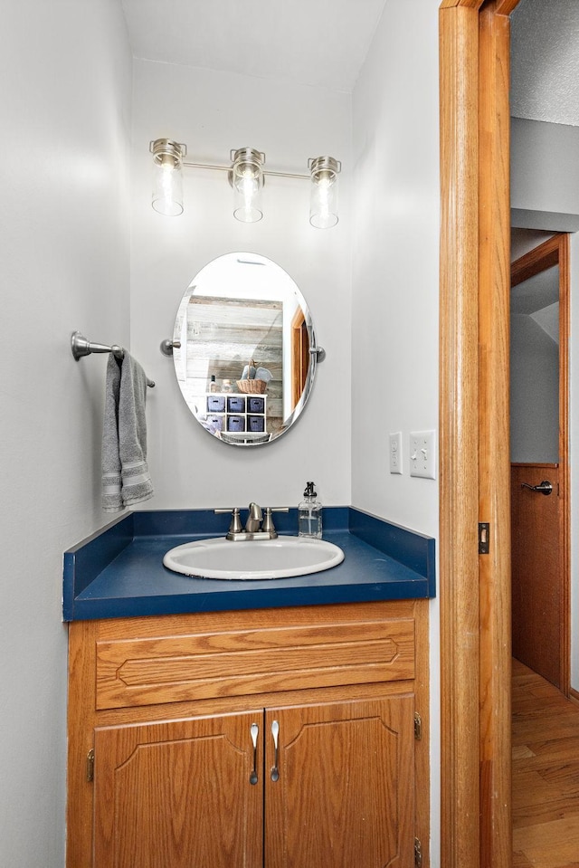 bathroom featuring vanity and wood finished floors