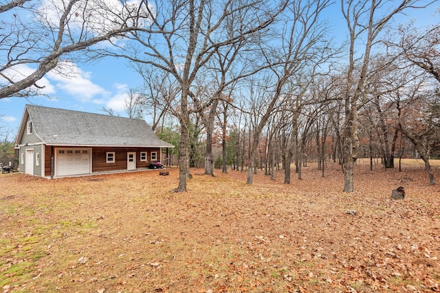 view of yard with a garage