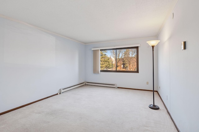 carpeted empty room with a baseboard heating unit, crown molding, a textured ceiling, and baseboards