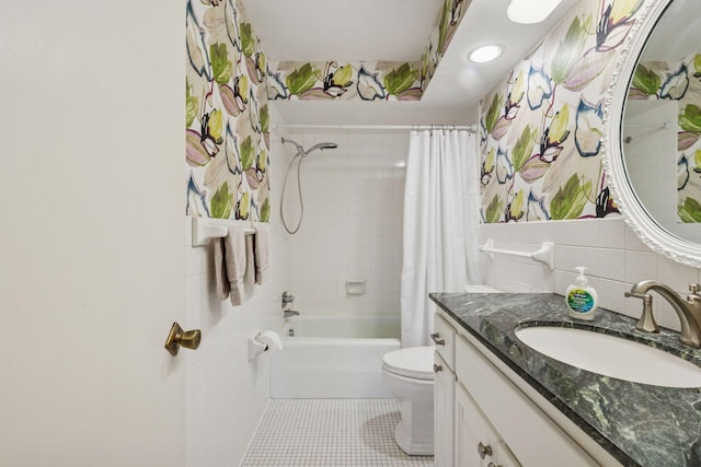 full bathroom featuring tile walls, toilet, shower / bath combo, vanity, and tile patterned floors