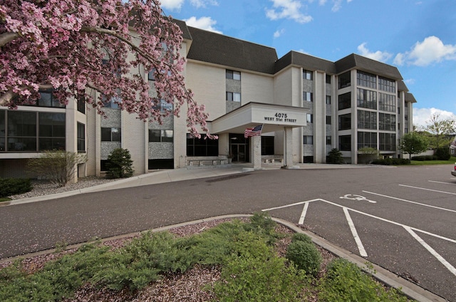 view of property featuring uncovered parking