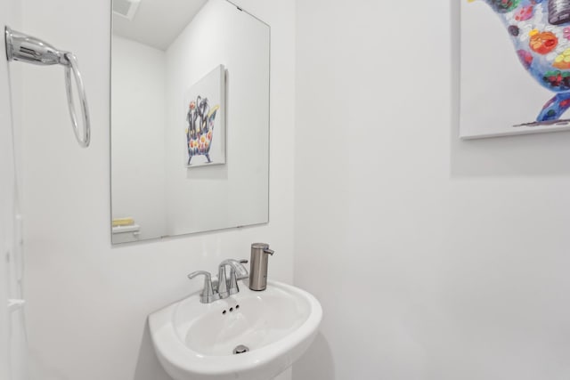 bathroom featuring a sink and visible vents