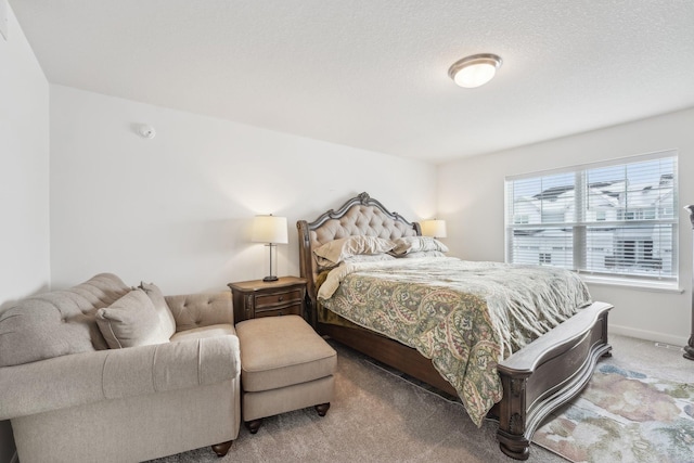 bedroom with carpet floors and baseboards