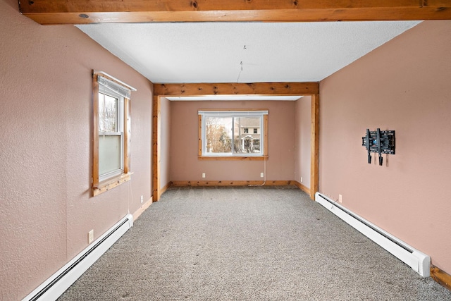 unfurnished room featuring a baseboard heating unit, light carpet, plenty of natural light, and baseboard heating