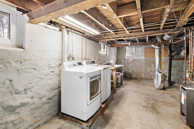 washroom featuring washing machine and dryer and laundry area