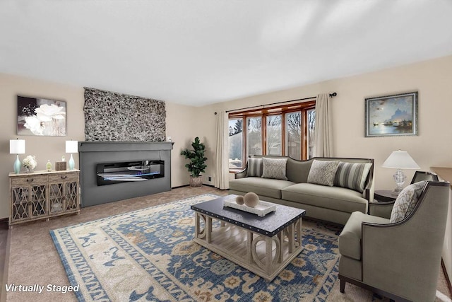 living room with carpet flooring and a glass covered fireplace