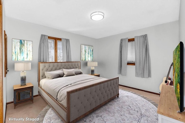 bedroom featuring carpet floors and baseboards